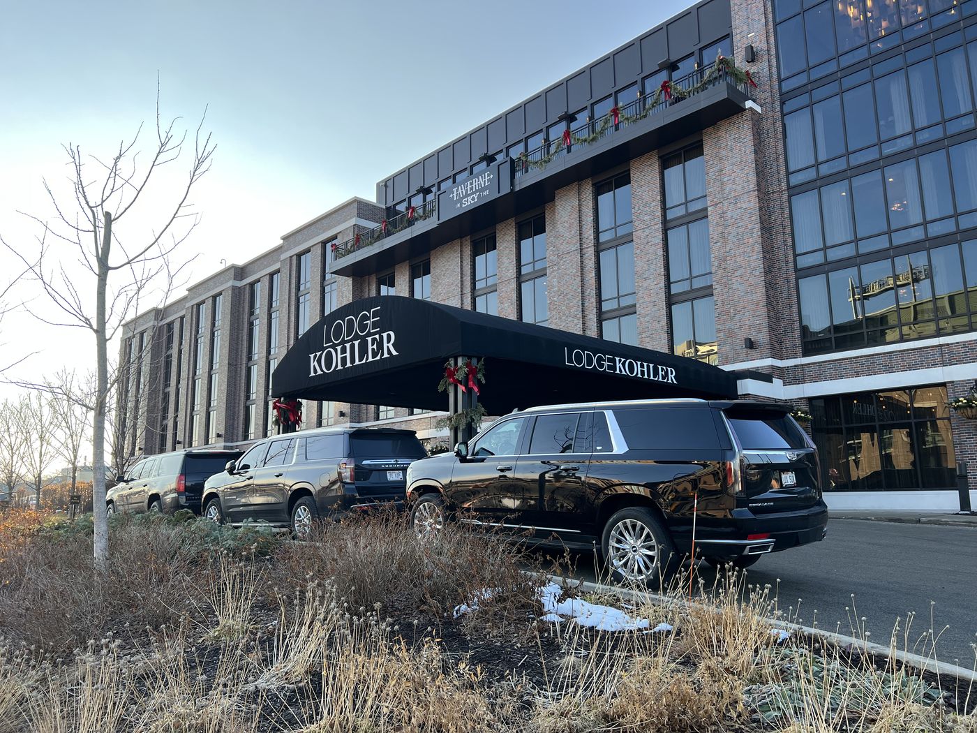 Black Cadillac Escalade ESV outside Lodge Kohler at Titletown, beside Lambeau Field in Green Bay