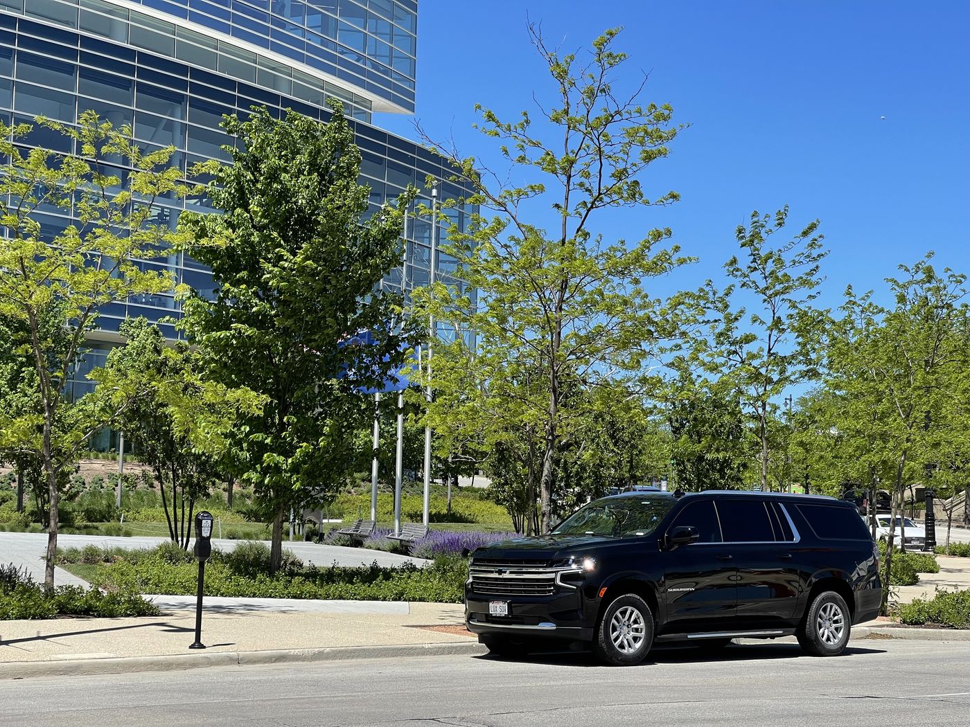 Black Chevrolet Suburban outside the Northwestern Mutual tower in downtown Milwaukee, a Mequon corporate destination